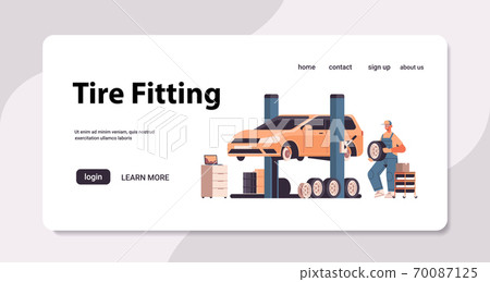 mechanic in uniform repairing tire man working and fixing wheel car service automobile repair and check up mechanic in uniform repairing tire man working and fixing wheel car service automobile repair and check up 70087125