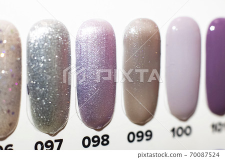 Multicolored nail polish on artificial plastic nails 70087524