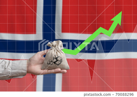 The concept of economic growth in Kingdom of Norway. Hand holds a bag with money and an upward arrow The concept of economic growth in Kingdom of Norway. Hand holds a bag with money and an upward arrow 70088296