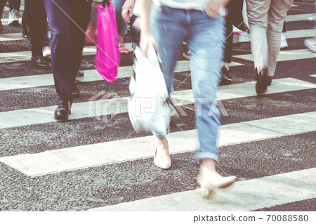 The concept of urban fuss with people crossing the road The concept of urban fuss with people crossing the road 70088580