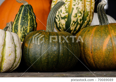Assortiment of pumpkins background 70089089