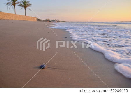 beautiful sunrise on a sandy beach 70089423