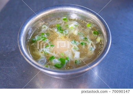 Bowl of Pho broth soup served with chicken egg Bowl of Pho broth soup served with chicken egg 70090147