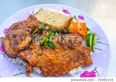 Delicious Vietnam grilled pork chop rice- Com Tam Delicious Vietnam grilled pork chop rice- Com Tam 70090158