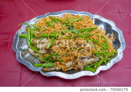 Vietnamese cuisine- stir-fried snail noodles and water spinach 70090179