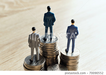 The concept is rich and wealthy people with abstract personas on coins The concept is rich and wealthy people with abstract personas on coins 70090552