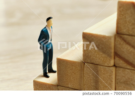 The concept of the career ladder at the beginning of the way employee The concept of the career ladder at the beginning of the way employee 70090556