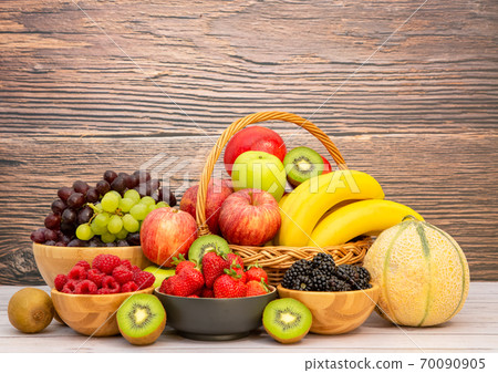 Group Healthy fresh fruit and vegetable in a wooden basket 70090905