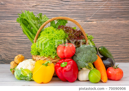 Group Healthy fresh fruit and vegetable in a wooden basket 70090906