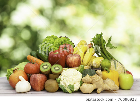 Group Healthy fresh fruit and vegetable in a wooden basket 70090928