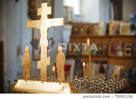 candles and  cross   in the Orthodox Church 70091196