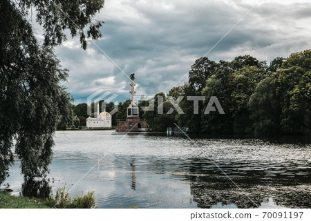 Park with a pond and an Oriental-style pavilion on the Bank, trees Park with a pond and an Oriental-style pavilion on the Bank, trees 70091197