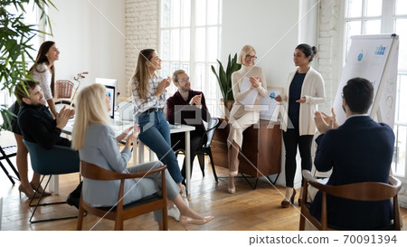 Indian female tea leader make whiteboard presentation in office 70091394