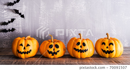 Orange ghost pumpkins with bats on gray wooden board background. halloween decoration concept. 70091507