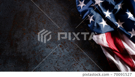 Happy Veterans Day concept. American flags against a dark stone  background. November 11. 70091527