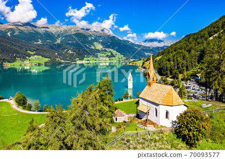 St. Anna Chapel and Submerged Bell Tower of Curon on Lake Reschen in South Tyrol, Italy 70093577