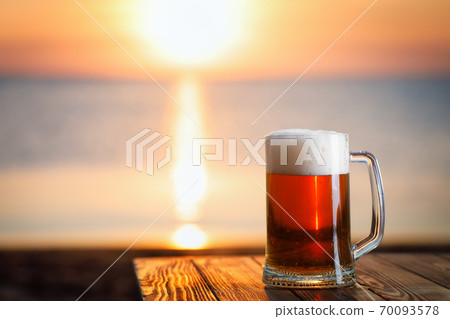 mug of dark beer with froth 70093578