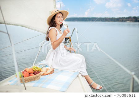 woman with glass of champagne 70093611