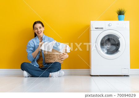 woman is doing laundry woman is doing laundry 70094029