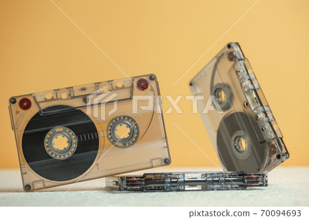 Beautiful Audio cassettes tape on a white table and yellow space.Minimalism retro style concept. 80s. Background pattern for design. 70094693
