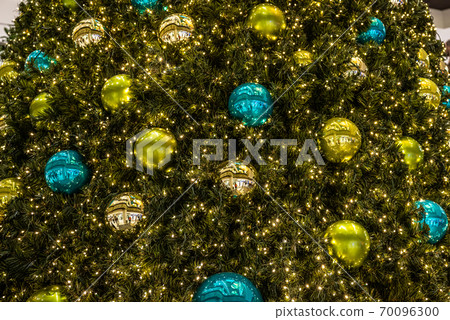 beautiful green Christmas tree colorful Hanging decoration balls closeup beautiful green Christmas tree colorful Hanging decoration balls closeup 70096300