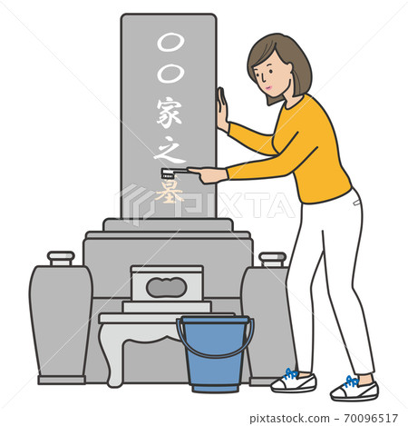 一個女人用刷子清洗墓碑 70096517