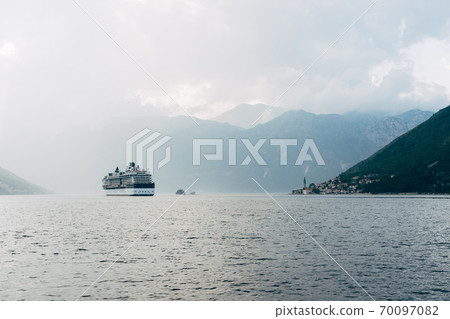 The cruise liner sails near the city of Perast and the islands in Montenegro. The cruise liner sails near the city of Perast and the islands in Montenegro. 70097082