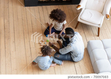 Loving african american bonding family playing toys. Loving african american bonding family playing toys. 70097083