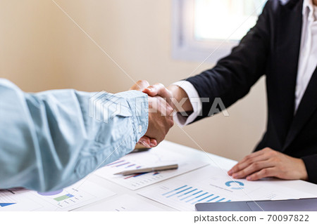 Meeting a team of businessmen, Executives and accountants meeting about the company's revenue graph in the office with laptops and calculators, Finance concept. Meeting a team of businessmen, Executives and accountants meeting about the company's revenue graph in the office with laptops and calculators, Finance concept. 70097822