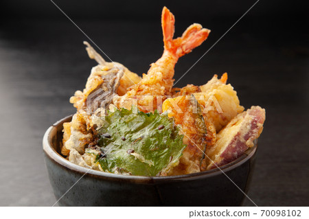 Bowl of rice and fried fish 70098102
