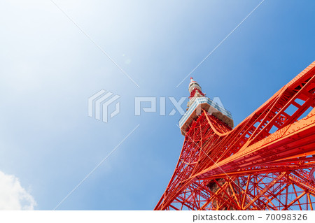 Tokyo Tower looking up from the blue sky and below 70098326