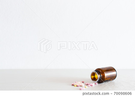 Medical concept, Multicolored pills were poured from the bottle, Drugs used to treat patients and relieve pain are antiseptics,Copy space for text. 70098606