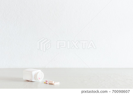 Medical concept, Multicolored pills were poured from the bottle, Drugs used to treat patients and relieve pain are antiseptics,Copy space for text. 70098607