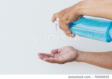 Alcohol gel is used for inhibition of bacteria and the virus Covid-19, Virus removal and protection of infections,Man pressed alcohol gel to wash hands, Virus covid-19 concept, Copy space for text 70098695