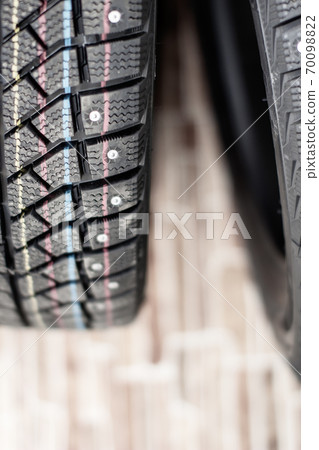 New, black winter car tires with spikes. New, black winter car tires with spikes. 70098822
