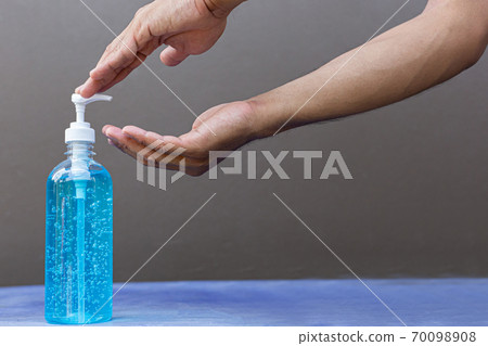 Alcohol gel is used for inhibition of bacteria and the virus Covid-19, Virus removal and protection of infections,Man pressed alcohol gel to wash hands, Virus covid-19 concept. 70098908
