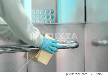 Sanitizing an elevator push button against bacteria and virus. Sanitizing an elevator push button against bacteria and virus. 70099518