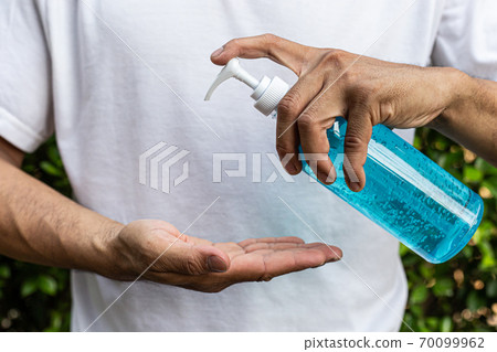 Alcohol gel is used for inhibition of bacteria and the virus Covid-19, Virus removal and protection of infections,Man pressed alcohol gel to wash hands, Virus covid-19 concept. 70099962