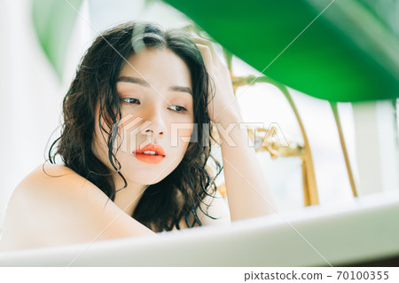 Woman in bath Woman in bath 70100355