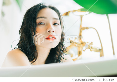 Woman in bath Woman in bath 70100356