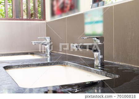 Public sinks, Handwashers for people using public toilets, Public toilets and hygiene concept. 70100818
