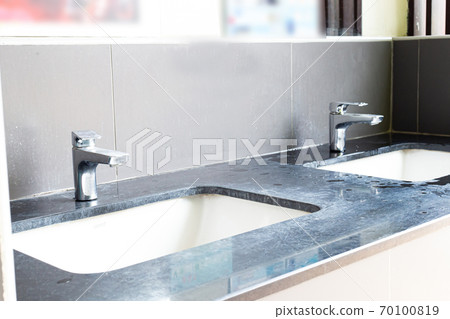 Public sinks, Handwashers for people using public toilets, Public toilets and hygiene concept. 70100819