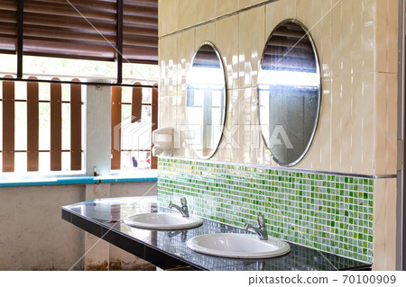 Public sinks, Handwashers for people using public toilets, Public toilets and hygiene concept. 70100909