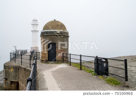 Brick dome-shaped city building and lighthouse in the morning mist in the suburbs of Edinburgh Brick dome-shaped city building and lighthouse in the morning mist in the suburbs of Edinburgh 70100968
