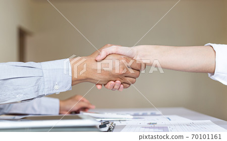 Greeting and meeting, business partners as partners shaking hands to congratulate each other to work together, Building friendship in real estate investment , handshake concept. Greeting and meeting, business partners as partners shaking hands to congratulate each other to work together, Building friendship in real estate investment , handshake concept. 70101161