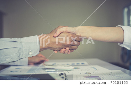 Greeting and meeting, business partners as partners shaking hands to congratulate each other to work together, Building friendship in real estate investment , handshake concept. Greeting and meeting, business partners as partners shaking hands to congratulate each other to work together, Building friendship in real estate investment , handshake concept. 70101163