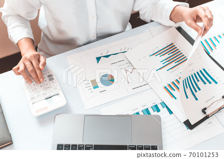 Accounting businessmen are calculating income-expenditure and analyzing real estate investment data, Financial and tax systems concept. Accounting businessmen are calculating income-expenditure and analyzing real estate investment data, Financial and tax systems concept. 70101253