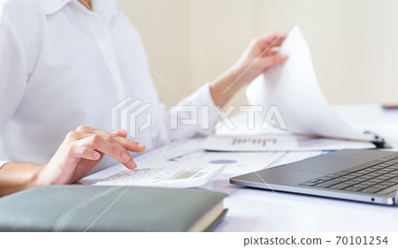 Accounting businessmen are calculating income-expenditure and analyzing real estate investment data, Financial and tax systems concept. 70101254