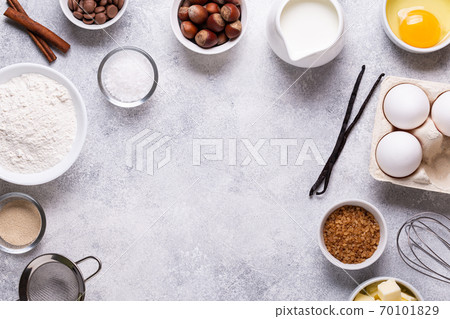 Ingredients for baking - flour, milk, salt, sugar, eggs. Ingredients for baking - flour, milk, salt, sugar, eggs. 70101829