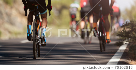 Cycling competition, cyclist athletes riding a race 70102813